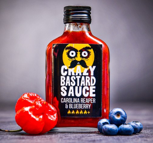 Šíleně pálivá omáčka Crazy Bastard Carolina Reaper & Blueberry 100 ml