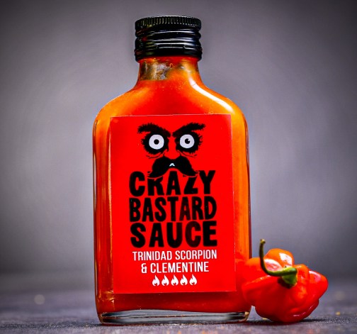 Velmi pikantní omáčka Crazy Bastard Trinidad Scorpion & Clementine 100 ml